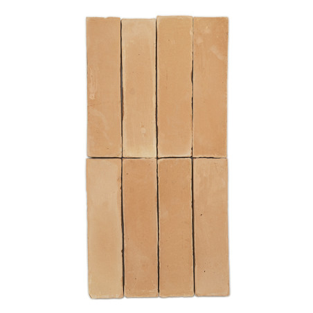 Rectangular terracotta tiles arranged vertically and horizontally, forming a grid pattern. Pale orange color with slight texture