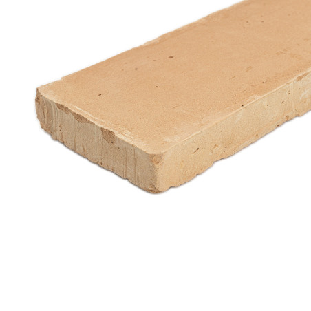 Rectangular terracotta tile lies flat, showcasing its smooth surface and rough edges, on a plain white background.