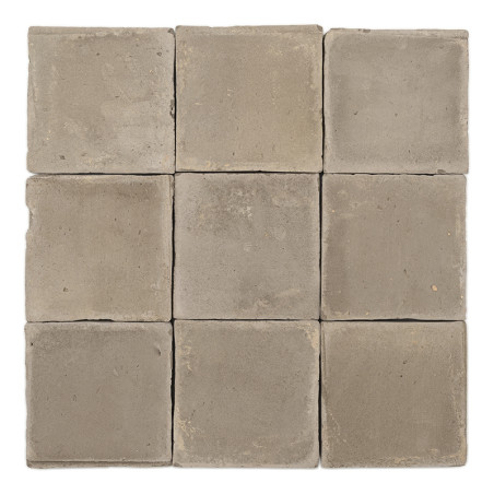 Nine square, earth-toned terracotta tiles are arranged in a neat grid, showing a rustic finish in neutral color.