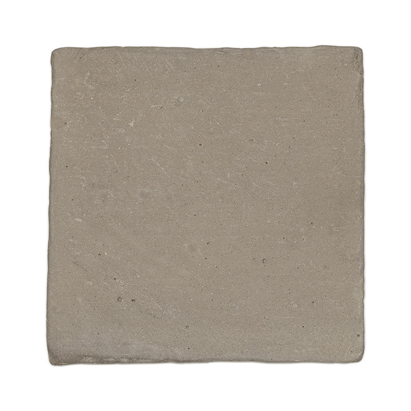 Square terracotta tile resting flat, displaying its earthy, grayish tone, with subtle texture and no distinct markings.