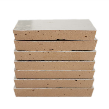 Six stacked rectangular terracotta tiles with smooth, light brown surfaces, sitting neatly against a plain white background.