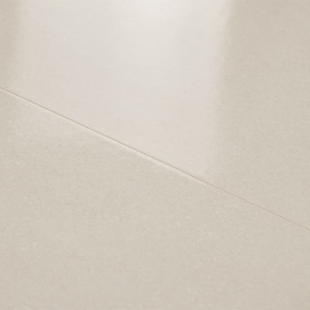 A smooth, light-colored tile reflects subtle light, highlighting its glossy surface, installed seamlessly within an indoor floor