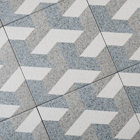 Los azulejos grises y blancos forman un patrón geométrico en zigzag entrelazado, creando un efecto visual dinámico en un ambient Los azulejos grises y blancos forman un patrón geométrico en zigzag entrelazado, creando un efecto visual dinámico en un ambient