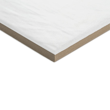 A square, white tile with a smooth surface and beige edges, resting at a slight angle against a plain, neutral background.