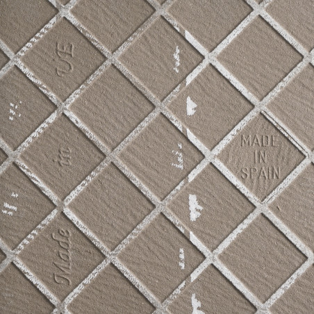 Tile image: Square tiles arranged diagonally with textured, matte surface. Text reads `MADE IN SPAIN,` with partial letters `Mad