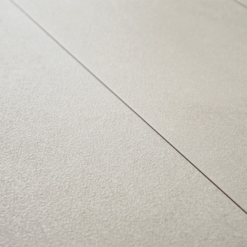 The beige tile features a textured surface with subtle grooves and fine lines, arranged in a staggered pattern on a smooth floor