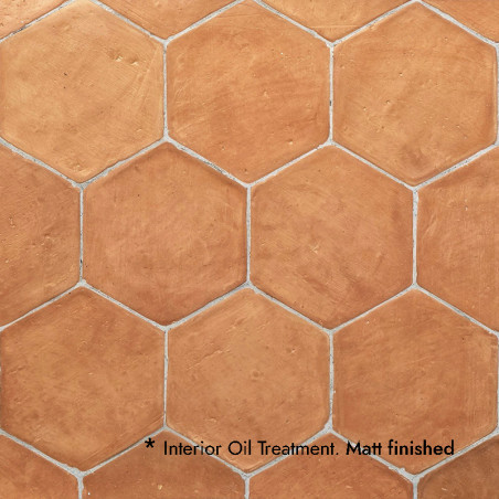 Azulejos de terracota hexagonales dispuestas de forma apretada. tratamiento de aceite interior aplicado. textura con acabado mat