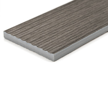 A rectangular tile exhibits a wood-grain texture, lying flat on a white surface, emphasizing its sleek, modern design in a minim